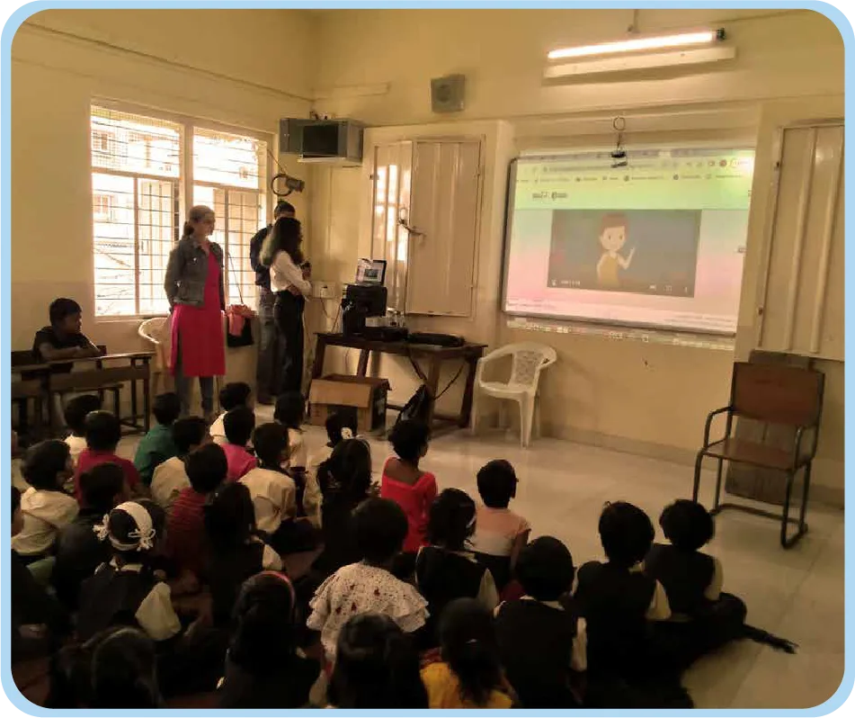 Children learning about cyber safety and responsible online behavior in a classroom training session